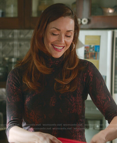 Abigail's red snake print top on Good Witch