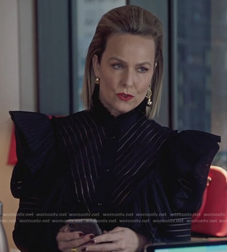Jacqueline's black ruffle blouse and leopard skirt on The Bold Type