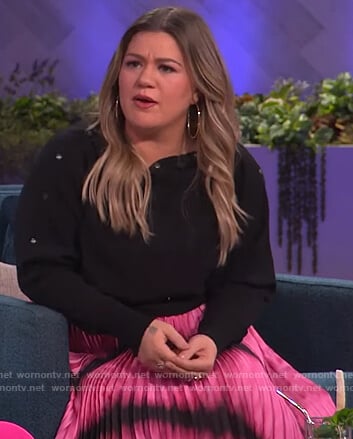 Kelly's black button embellished sweater and tie dye skirt on The Kelly Clarkson Show