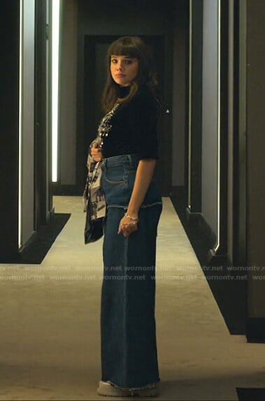 Mencia's black safety pin top and wide-leg jeans on Elite