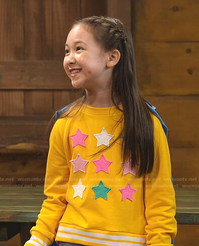 Nadine's yellow star patch sweatshirt on Bunkd