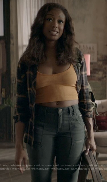 Ryan's plaid shirt and ribbed crop top on Batwoman