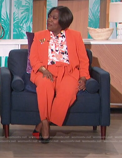 Sheryl's floral tie neck blouse and blazer on The Talk