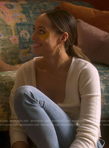 Whitney's white cardigan on Run the World