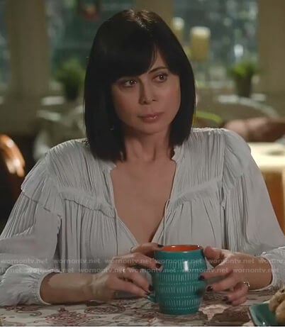Cassie's light grey pleated tie neck blouse on Good Witch