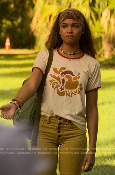 Kiara's Her Waves t-shirt, yellow jeans and tie dye headband on Outer Banks