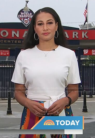 Morgan Radford's white top and mixed print pleated skirt on Today