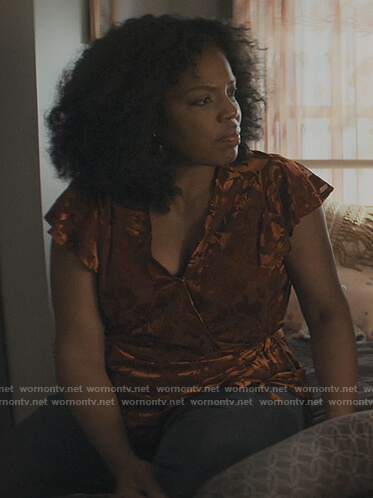 Nina's orange floral wrap top on The Chi