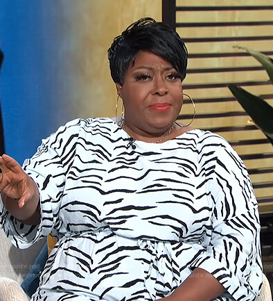 Loni's white zebra print jumpsuit on E! News Daily Pop