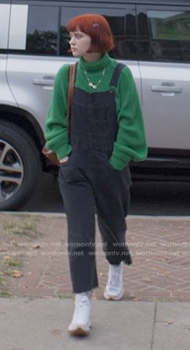 Scarlett's green turtleneck and denim overalls with platform sneakers on American Horror Stories
