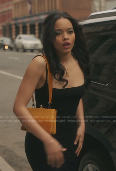 Zoya's black dress and orange shoulder bag on Gossip Girl