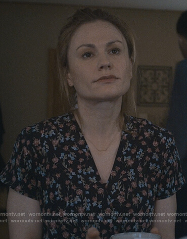 Isabelle's black floral v-neck top on Modern Love