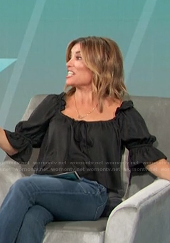 Kit's black ruffle sleeve top on Access Hollywood