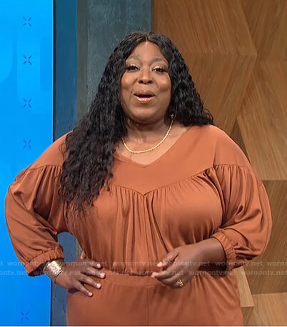 Loni's brown gathered jumpsuit on E! News Daily Pop