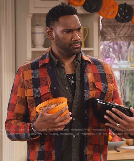 Moz's multicolored check jacket on Family Reunion