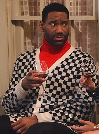 Moz's checkered cardigan on Family Reunion