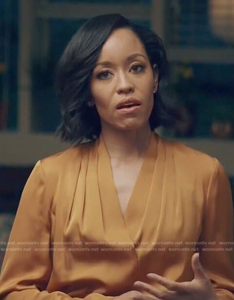 Charley's orange pleated v-neck blouse on Queen Sugar