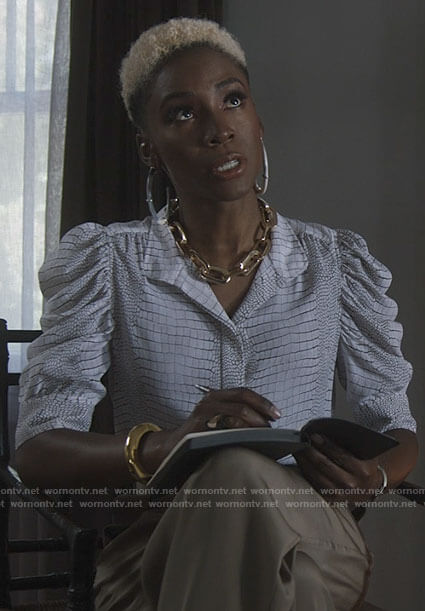 The Chemist's white snake print puff sleeve top on American Horror Story