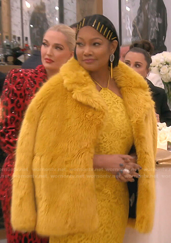 Garcelle's yellow floral lace dress and fur coat on The Real Housewives of Beverly Hills