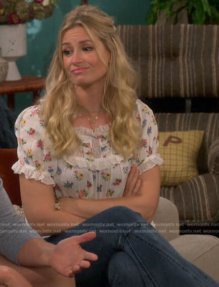 Gemma's white floral top and flared jeans on The Neighborhood