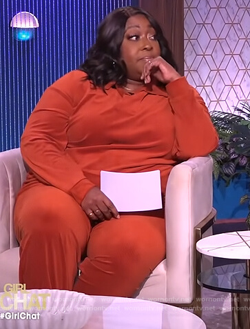 Loni's orange corduroy sweater and pants on The Real