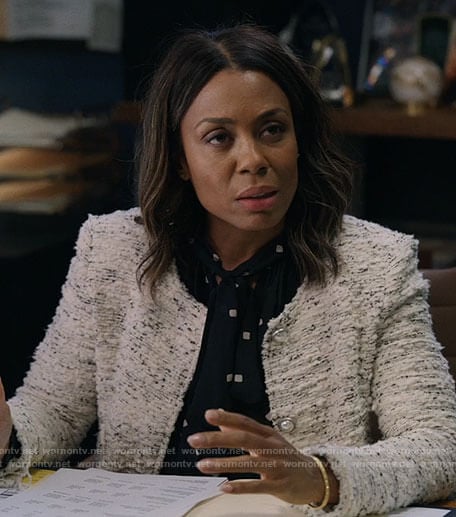 Mia's black dotted blouse and white tweed jacket on The Morning Show