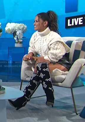 Rocsi Diaz's white cable knit sweater and studded boots on E! News Daily Pop