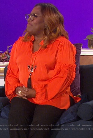 Sheryl's orange ruffle blouse on The Talk