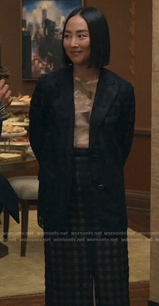 Stella's black checked blazer and pants on The Morning Show