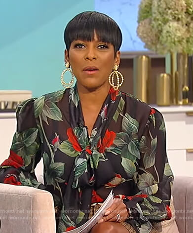 Tamron's black floral print tie neck blouse on Tamron Hall Show