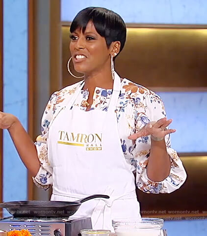 Tamron's white floral belted jumpsuit on Tamron Hall Show