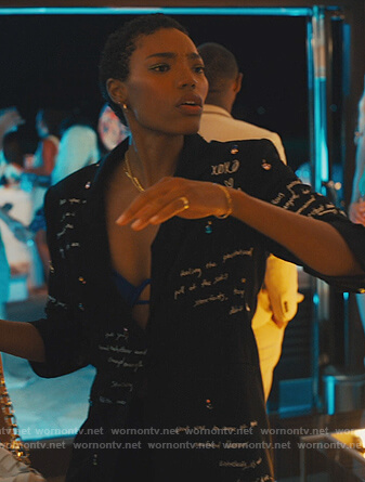 Taylor's black cursive printed blazer on Our Kind of People