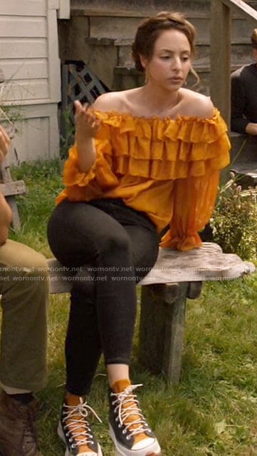 Zari's orange ruffled top and sneakers on Legends of Tomorrow