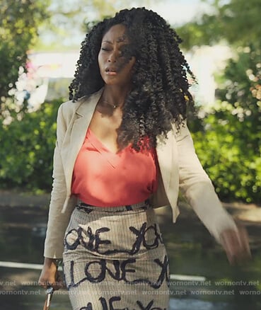 Angela's plaid Love print skirt on Our Kind of People