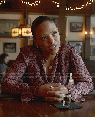 Danny's purple printed tie neck blouse on Bull
