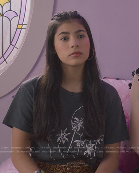 Dawn's black palm tree graphic tee on The Baby-Sitters Club