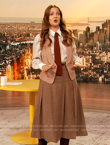 Drew's stripe blouse and check skirt on The Drew Barrymore Show
