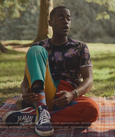 Eric's floral tee and colorblock pants on Sex Education