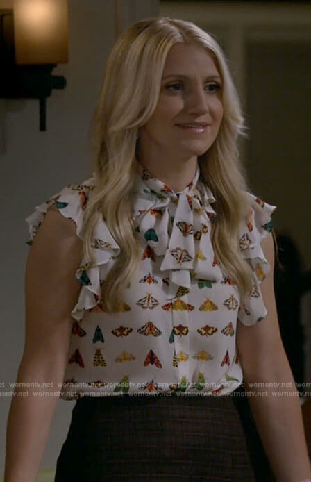 Gina's butterfly print top and plaid skirt on B Positive
