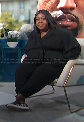 Loni's black shawl collar jumpsuit on E! News Daily Pop