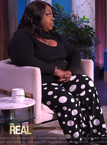 Loni's black cutout sweater and printed pants on The Real