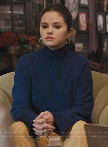 Mabel's mini hoop earrings and boots on Only Murders in the Building
