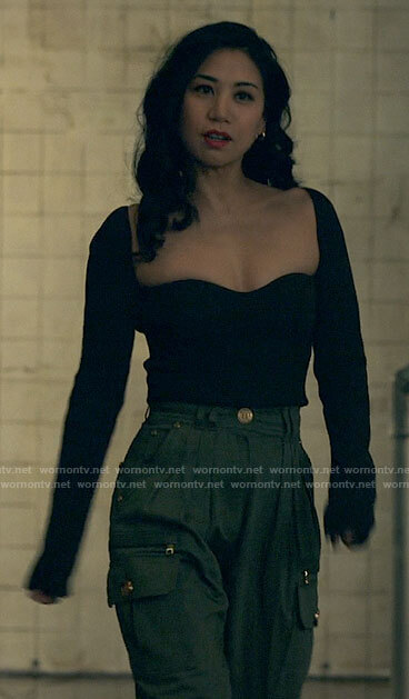 Mel's black long sleeved top and green cargo pants on The Equalizer