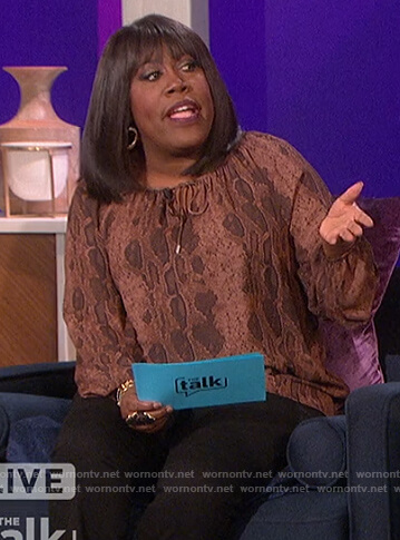 Sheryl's brown snake print blouse on The Talk