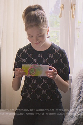 Stacey's M logo sweater on The Baby-Sitters Club
