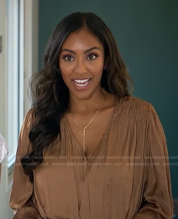 Tayshia's brown v-neck satin blouse on The Bachelorette