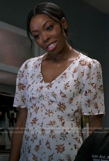 Vanessa's white floral v-neck top on Chicago Med