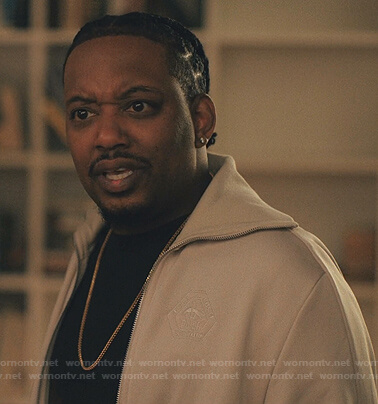 Yogi's white track jacket on Love Life