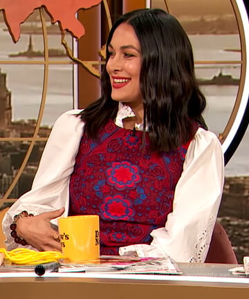 Brie Bella's red floral dress and embroidered blouse on The Drew Barrymore Show