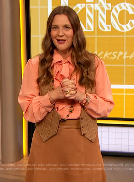 Drew's coral tie neck blouse on The Drew Barrymore Show